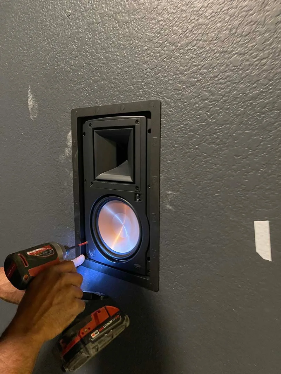 There is a hole in the wall that looks like a window.